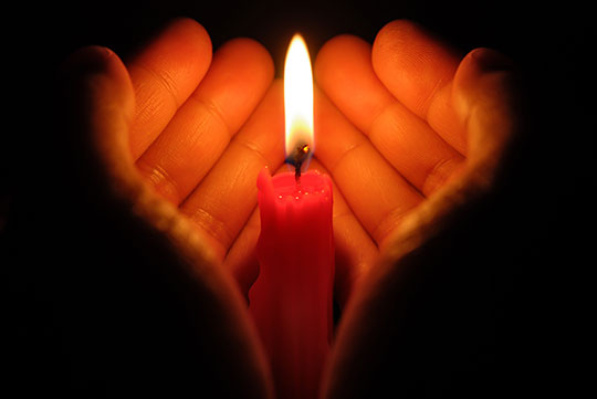 hand holding candle