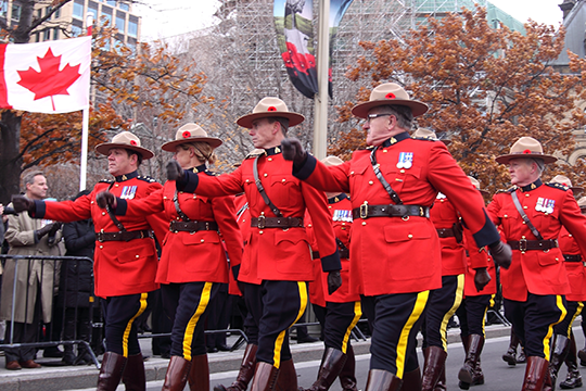 Members of the Royal Canadian Mounted Police marching.