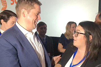 Advocacy coordinator Candace Jazvac asks Conservative Party leader Andrew Scheer about member priorities at the 2019 Manning Networking Conference.