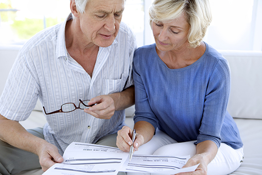 Senior couple doing home finances. Senior couple doing home finances.