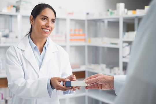 A pharmacist handing a bottle of pills to a patient The Treasury Board has announced the new PSHCP monthly contribution rates
