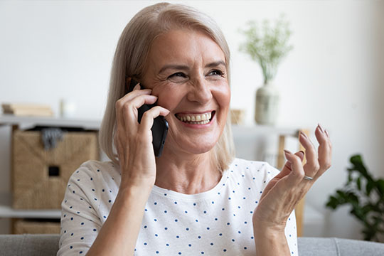 Woman on phone Volunteer with Federal Retirees!