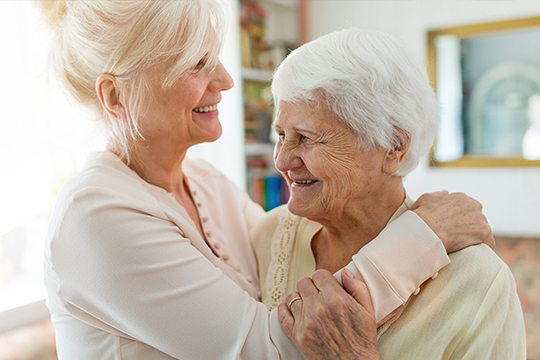 Older adult with caregiver.