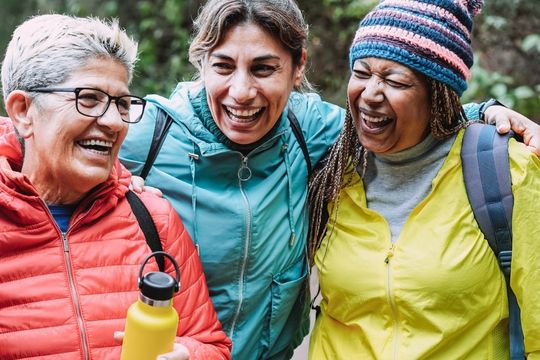 Three happy adult women volunteers.