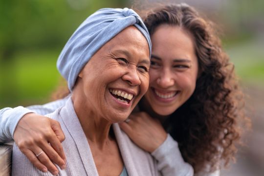 Older adult with caregiver.