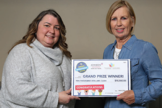 The rewards of friendship Lynn Nasralla, a senior consultant with Johnson Insurance, presents a $10,000 cheque to Mega Recruitment Drive grand prize winner Valdine Christiansen.