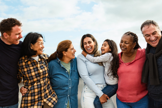 Multigenerational group spending time together outside.