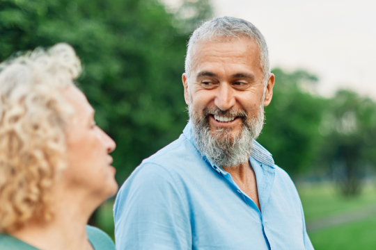 Two friends chatting in a community park.