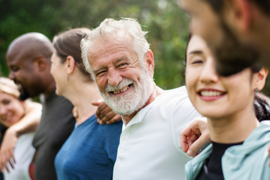 Multigenerational group spending time together outside.