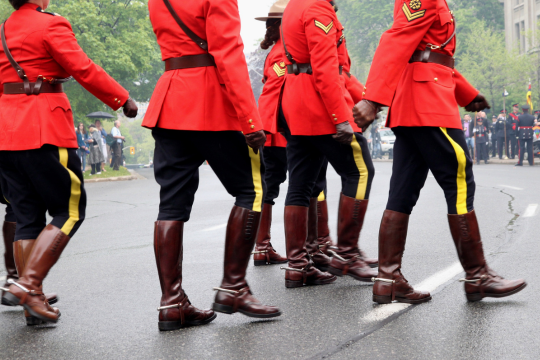 Uniformed members of the RCMP march in Toronto, Ontario.