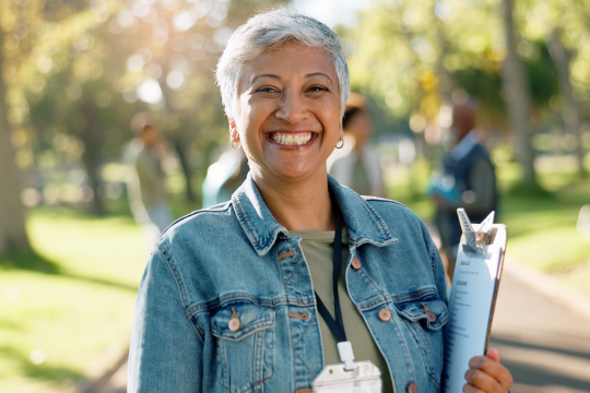 Portrait of a happy volunteer in a public park.