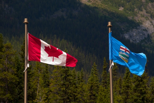 Flags of Alberta and Canada side by side.