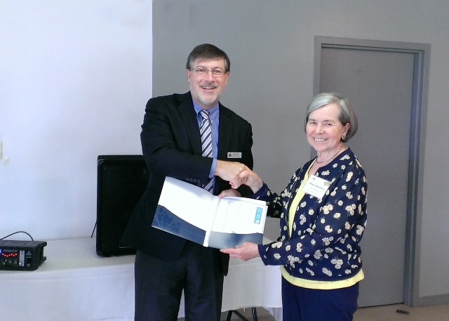 Simon Coakley, CEO National Association of Federal Retirees (NAFR) Presenting volunteer award to Mary Stevens.