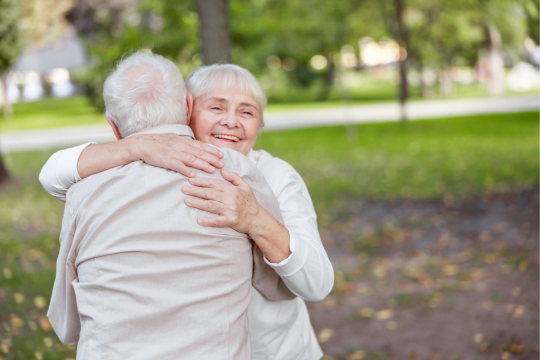 Man and woman hugging.