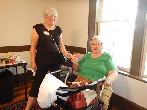 Meet and Greet 8 Kathy Rupnow (standing) with Donna Wallace (sitting) and presenting her with the door price.