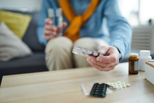 Adult man with several medications.