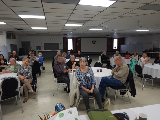 Members listening to reports from Board members