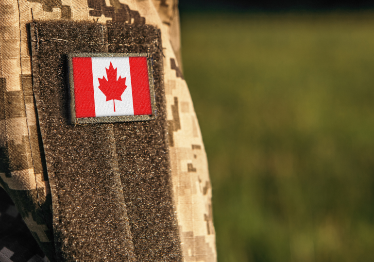 Flag of Canada on the military uniform.