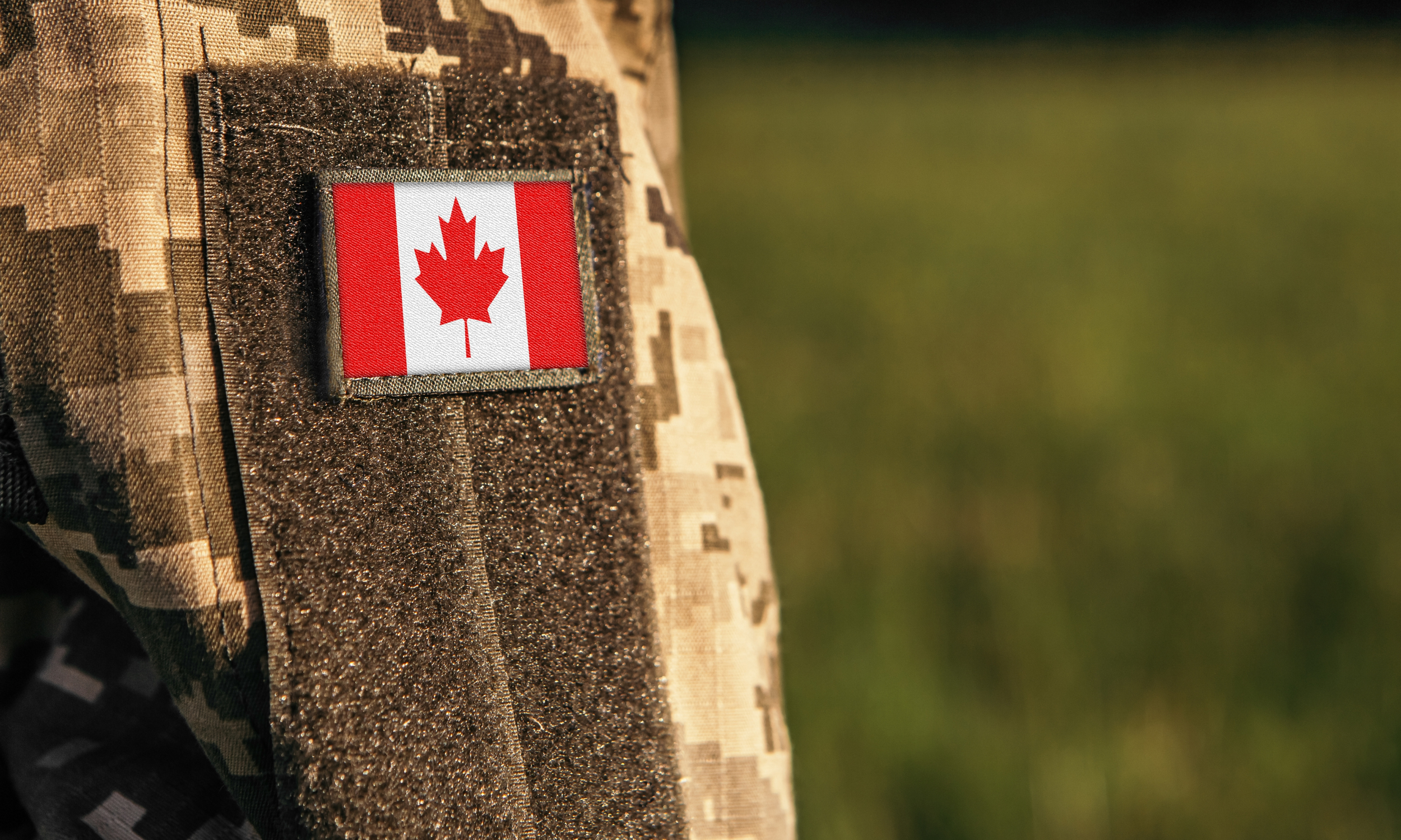 Flag of Canada on the military uniform.