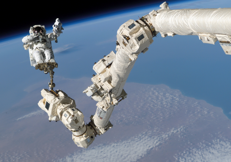 Astronaut Stephen Robinson anchored to Canadarm2 on Aug. 5, 2005.