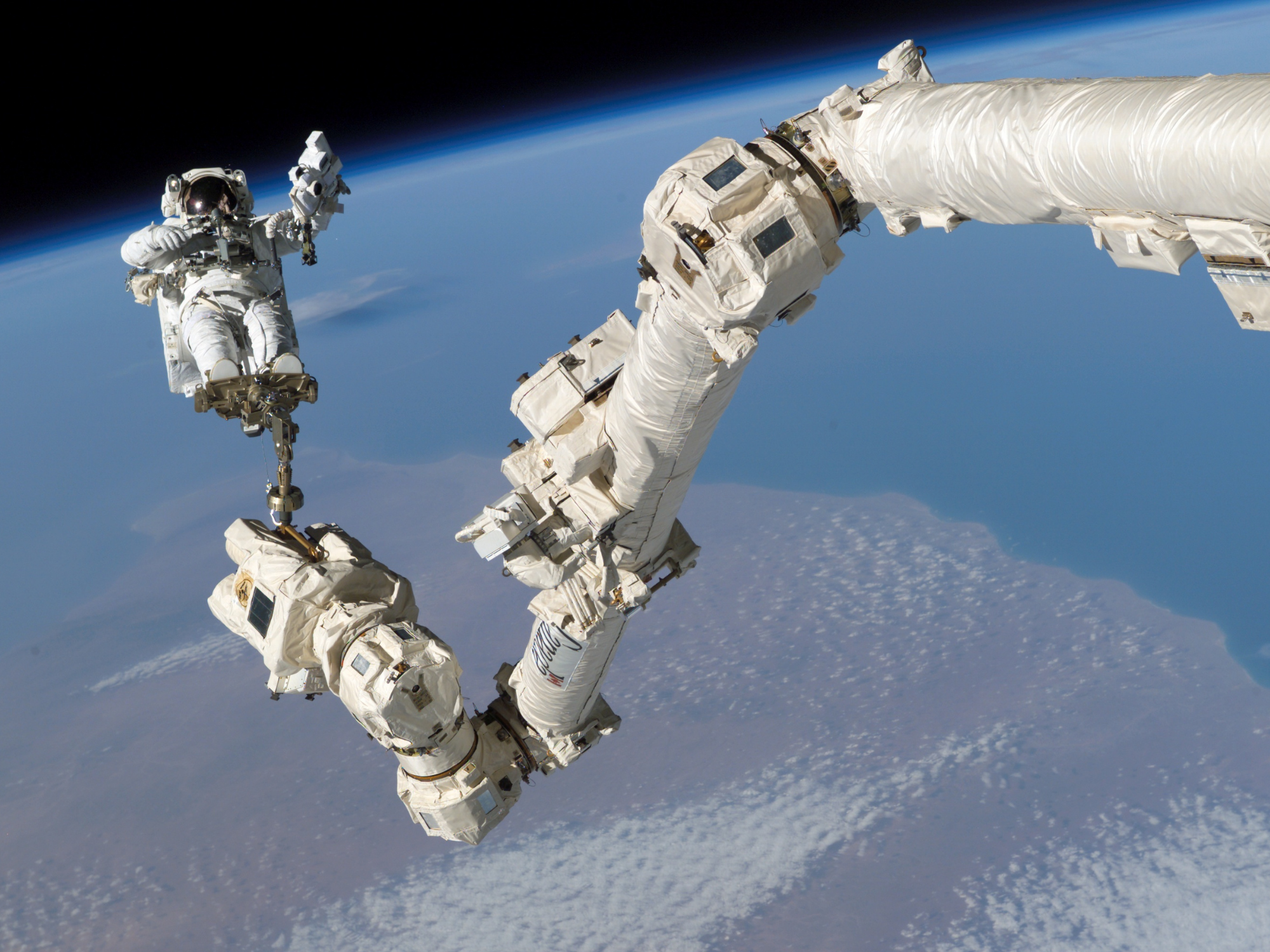 Astronaut Stephen Robinson anchored to Canadarm2 on Aug. 5, 2005.