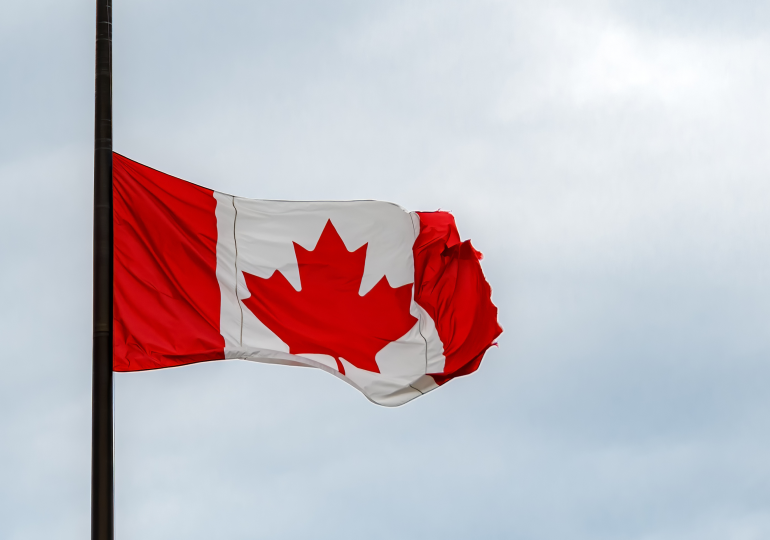 Canadian flag at half-mast.